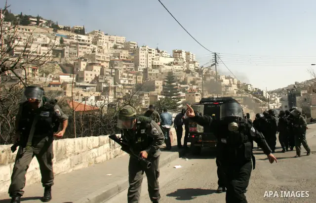 Israeli forces take positions during clashes with Palestinian youths in the east Jerusalem neighborhood of Silwan, Friday, March 4, 2011. Photo by Mahfouz Abu Turk