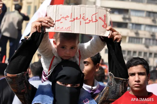 Demonstrators take part in a protest at Tahrir Square in Cairo, Egypt, Friday, March 4, 2011. Egypt's new prime minister designate has vowed before thousands of mostly young demonstrators at a central Cairo square that h...