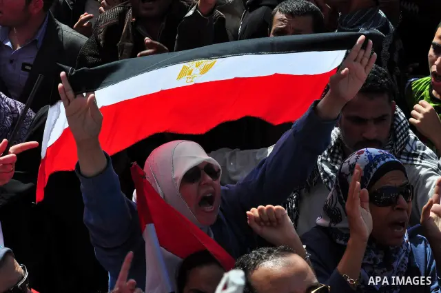 Demonstrators take part in a protest at Tahrir Square in Cairo, Egypt, Friday, March 4, 2011. Egypt's new prime minister designate has vowed before thousands of mostly young demonstrators at a central Cairo square that h...