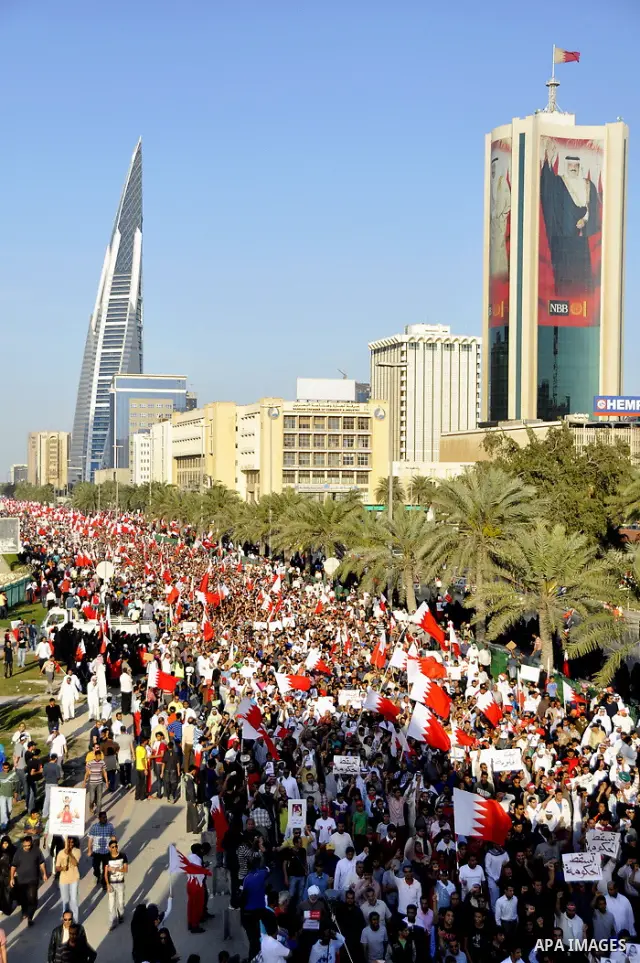 Tens of thousands of Bahraini anti-government protesters march Friday, March 4, 2011, from the main government house in the capital of Manama, Bahrain, to the Pearl roundabout, where they have set up camp. Also on Friday...
