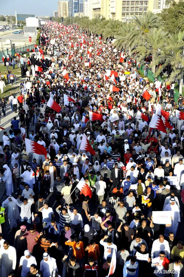 Tens of thousands of Bahraini anti-government protesters march Friday, March 4, 2011, from the main government house in the capital of Manama, Bahrain, to the Pearl roundabout, where they have set up camp. Also on Friday...