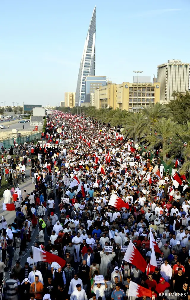 Tens of thousands of Bahraini anti-government protesters march Friday, March 4, 2011, from the main government house in the capital of Manama, Bahrain, to the Pearl roundabout, where they have set up camp. Also on Friday...