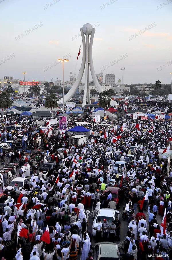 Tens of thousands of Bahraini anti-government protesters march Friday, March 4, 2011, from the main government house in the capital of Manama, Bahrain, to the Pearl roundabout, where they have set up camp. Also on Friday...