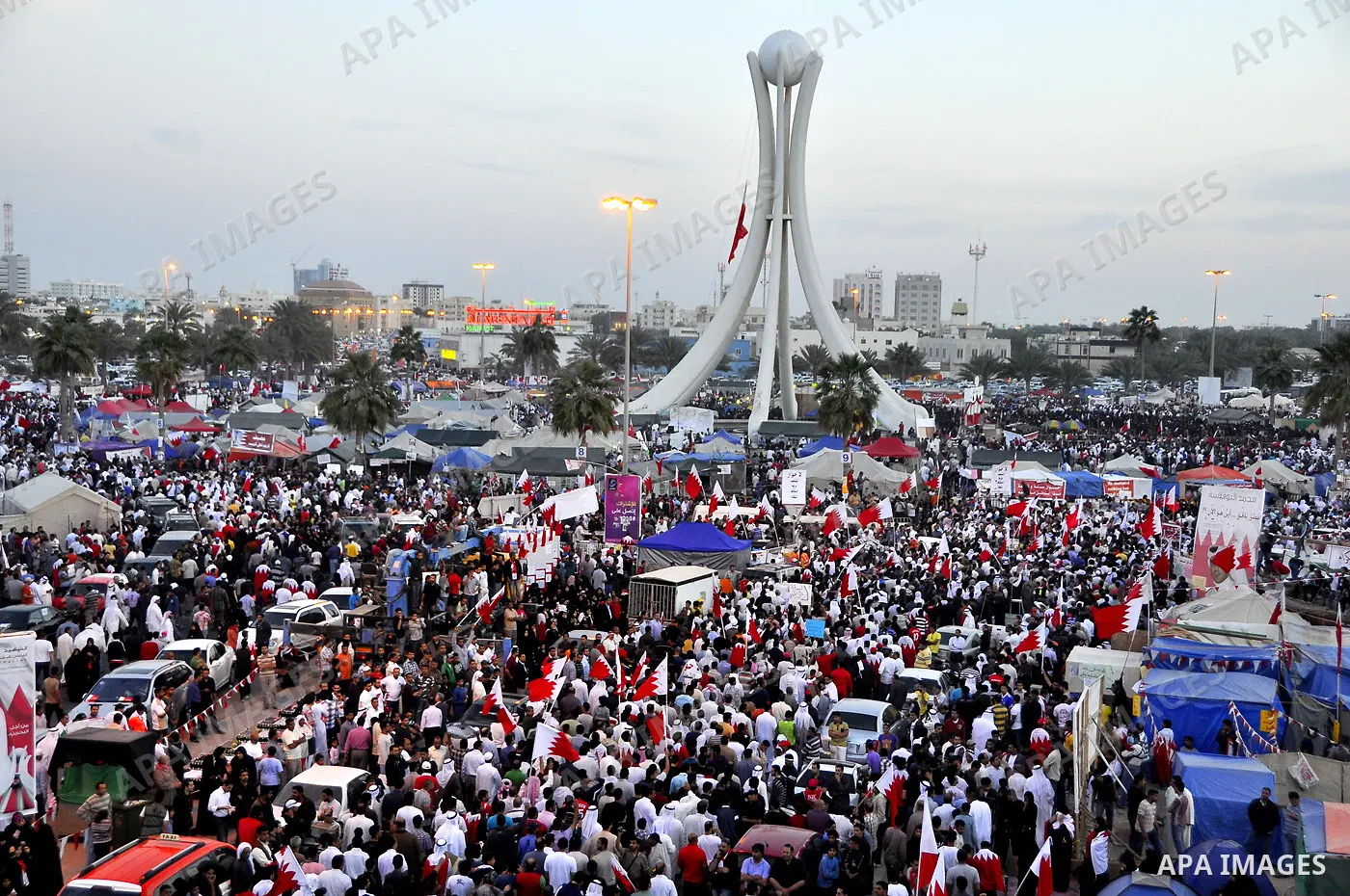 Tens of thousands of Bahraini anti-government protesters march Friday, March 4, 2011, from the main government house in the capital of Manama, Bahrain, to the Pearl roundabout, where they have set up camp. Also on Friday...
