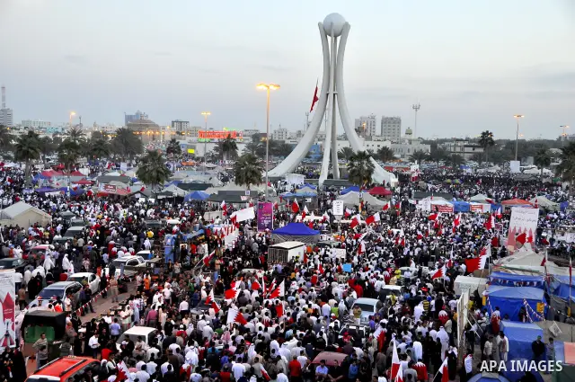 Tens of thousands of Bahraini anti-government protesters march Friday, March 4, 2011, from the main government house in the capital of Manama, Bahrain, to the Pearl roundabout, where they have set up camp. Also on Friday...