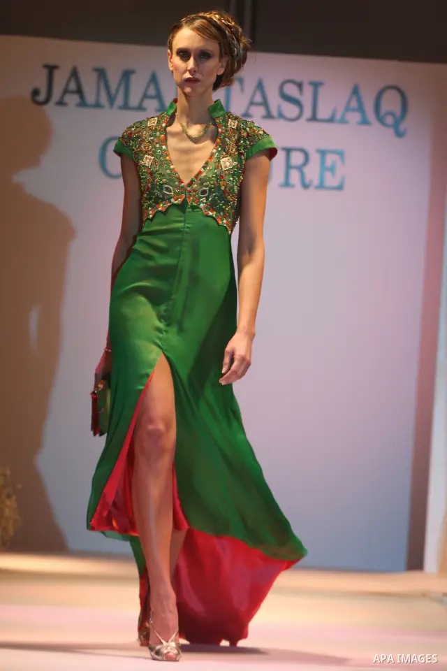 A model takes the catwalk wearing a design by Palestinian fashion designer Jamal Taslaq during a fashion show sponsored by the Italian Consulate-General and the Palestinian Ministry of Culture as part of a wedding fair i...