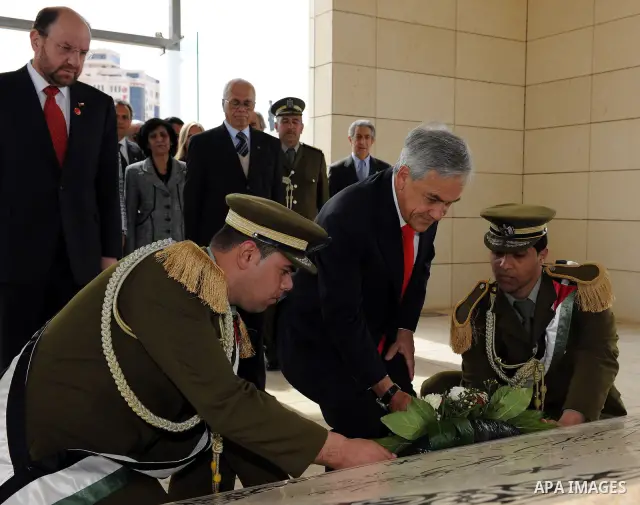 Chile's President Sebastian Pinera lays a wreath at the tomb of the late Palestinian President Yasser Arafat in the West Bank town of Ramallah on March 5,2011. In the second day visit of Pinera that will also take him to...