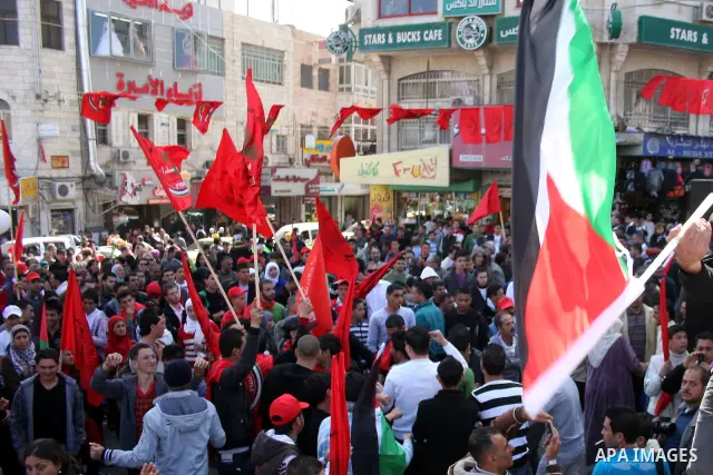 Palestinian supporters of the Palestinian Democratic Union Party (FEDA) take part in a rally celebrating 42 years since its founding in the West Bank city of Ramallah, Saturday 05 March 2011. Photo by Issam Rimawi