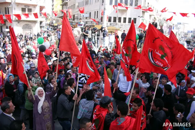 Palestinian supporters of the Palestinian Democratic Union Party (FEDA) take part in a rally celebrating 42 years since its founding in the West Bank city of Ramallah, Saturday 05 March 2011. Photo by Issam Rimawi