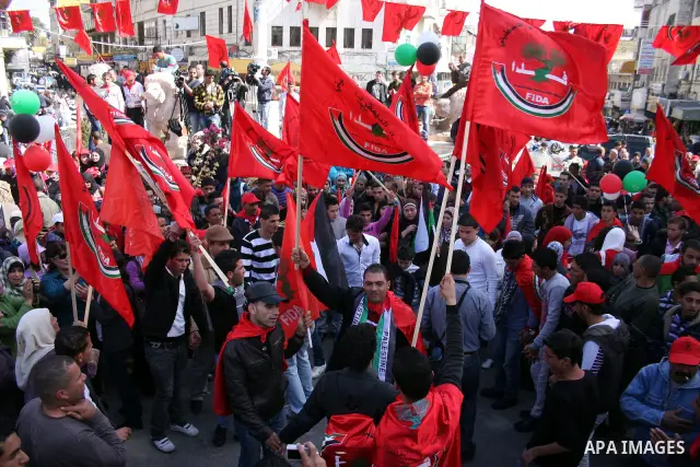 Palestinian supporters of the Palestinian Democratic Union Party (FEDA) take part in a rally celebrating 42 years since its founding in the West Bank city of Ramallah, Saturday 05 March 2011. Photo by Issam Rimawi