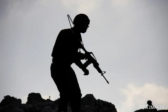 An Israeli soldier aims his weapon during a demonstration by foreign, Israeli and Palestinian activists against the expansion of Jewish settlements on March 5, 2011 in the village of Iraq Burin, south of the northern Wes...
