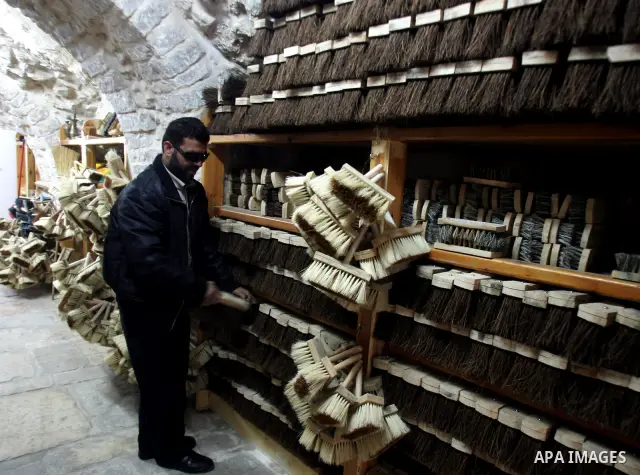 Palestinian blind men work in making brooms at a workshop in the Old City of Jerusalem on March 5,2011. The workshop is owned and managed by the Arab Blind Association, which was founded by blind Palestinians in 1932, an...
