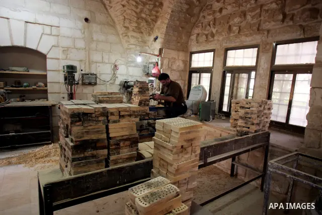 Palestinian blind men work in making brooms at a workshop in the Old City of Jerusalem on March 5,2011. The workshop is owned and managed by the Arab Blind Association, which was founded by blind Palestinians in 1932, an...