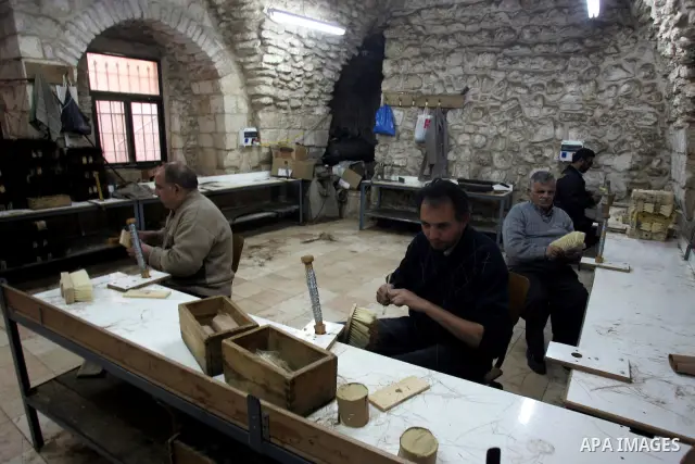 Palestinian blind men work in making brooms at a workshop in the Old City of Jerusalem on March 5,2011. The workshop is owned and managed by the Arab Blind Association, which was founded by blind Palestinians in 1932, an...