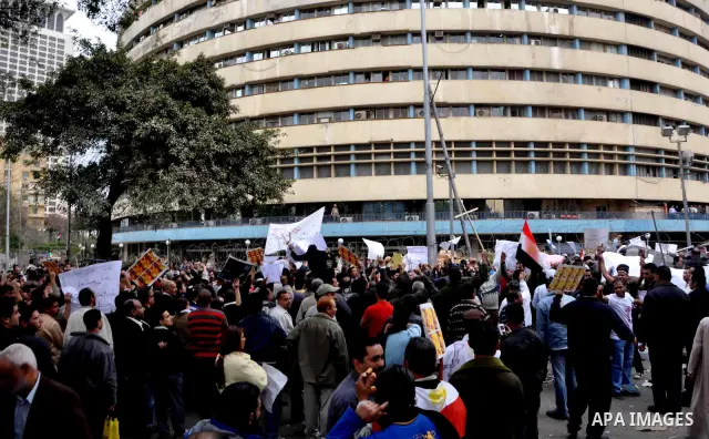 Egyptian christian protesters take part in a demonstration after burning a church in Hilwan, in front of the state television building headquarters in Cairo, Egypt, Sunday, March 6, 2011. Three weeks after President Hosn...