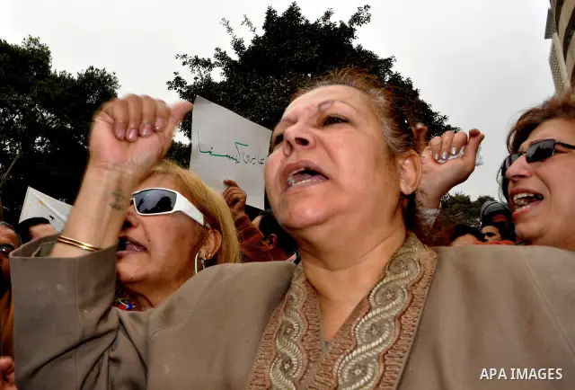 Egyptian christian protesters take part in a demonstration after burning a church in Hilwan, in front of the state television building headquarters in Cairo, Egypt, Sunday, March 6, 2011. Three weeks after President Hosn...