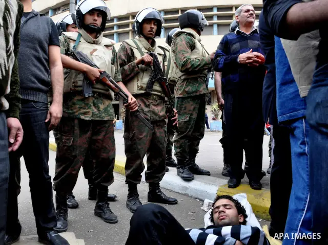 Egyptian christian protesters take part in a demonstration after burning a church in Hilwan, in front of the state television building headquarters in Cairo, Egypt, Sunday, March 6, 2011. Three weeks after President Hosn...