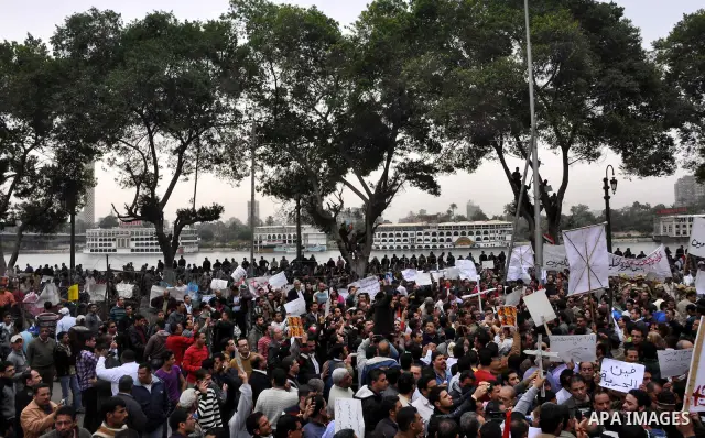 Egyptian christian protesters take part in a demonstration after burning a church in Hilwan, in front of the state television building headquarters in Cairo, Egypt, Sunday, March 6, 2011. Three weeks after President Hosn...