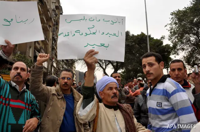 Egyptian christian protesters take part in a demonstration after burning a church in Hilwan, in front of the state television building headquarters in Cairo, Egypt, Sunday, March 6, 2011. Three weeks after President Hosn...