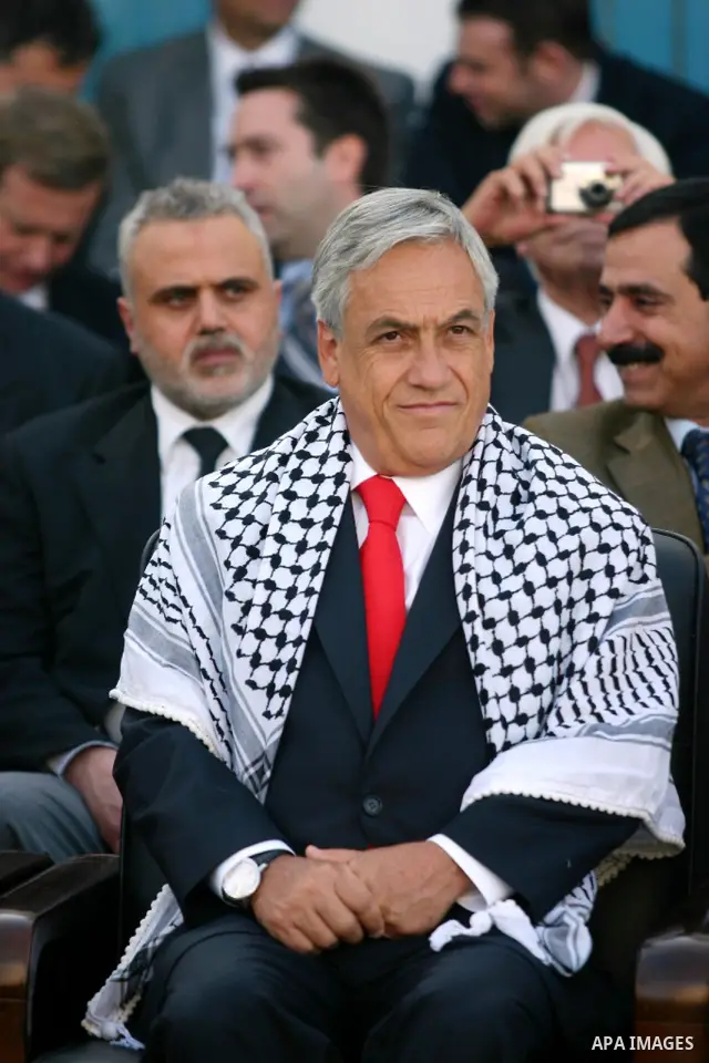 Chilean President Sebastian Pinera and his wife Cecilia Morel are greeted by Palestinian during their arrival at the Church of the Nativity, the site revered as the birthplace of Jesus, in the West Bank town of Bethlehem...