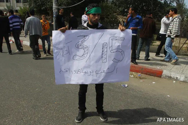 Palestinians shout slogans during a protest in Gaza City calling for unity between the Hamas Islamist group and its bitter West Bank rival Fatah party, on March 7, 2011, a day after Hamas police detained several proteste...