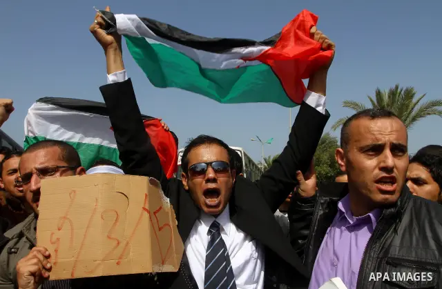 Palestinians shout slogans during a protest in Gaza City calling for unity between the Hamas Islamist group and its bitter West Bank rival Fatah party, on March 7, 2011, a day after Hamas police detained several proteste...