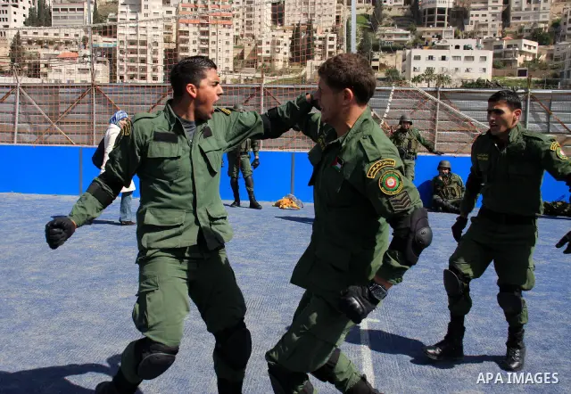 Palestinian security officers take part in a training session in the West Bank city of Nablus, Monday, March 7, 2011 . Photo by Wagdi Eshtayah