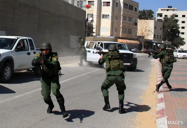 Palestinian security officers take part in a training session in the West Bank city of Nablus, Monday, March 7, 2011 . Photo by Wagdi Eshtayah