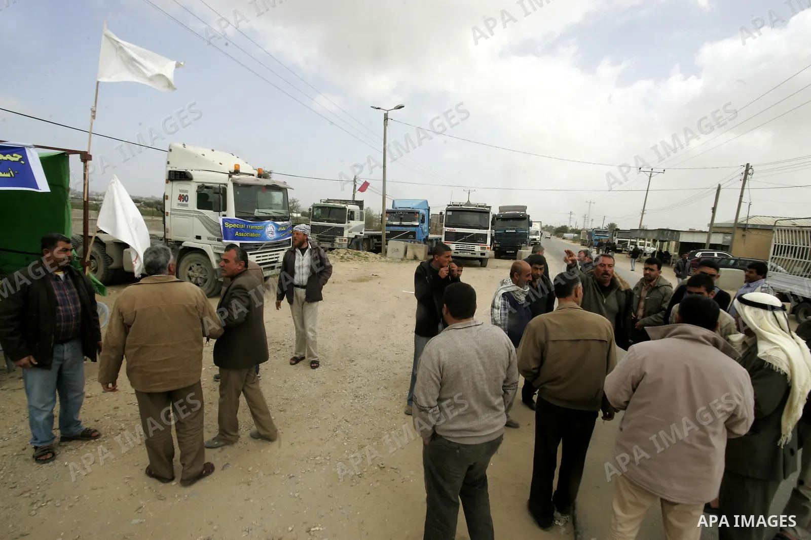 Palestinians stop with their lorries near the crossing of the Israeli crossing Kerem Shalom during a protest against the Israeli decision to close the Karni crossing, in the southern Gaza Strip on March 07, 2011. The own...