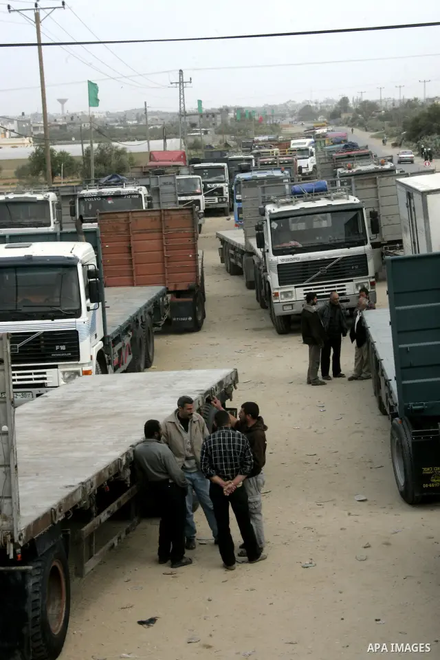 Palestinians stop with their lorries near the crossing of the Israeli crossing Kerem Shalom during a protest against the Israeli decision to close the Karni crossing, in the southern Gaza Strip on March 07, 2011. The own...