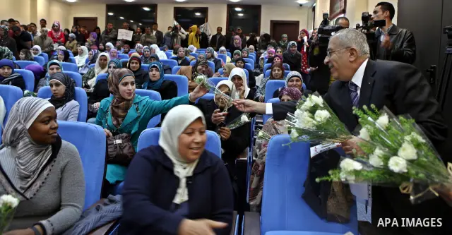 Palestinian Prime Minister, Salam Fayyad receives a note from the Palestinian workers general union about the rights of women workers in the West Bank city of Ramallah on March7, 2011. Photo by Mustafa Abu Dayeh