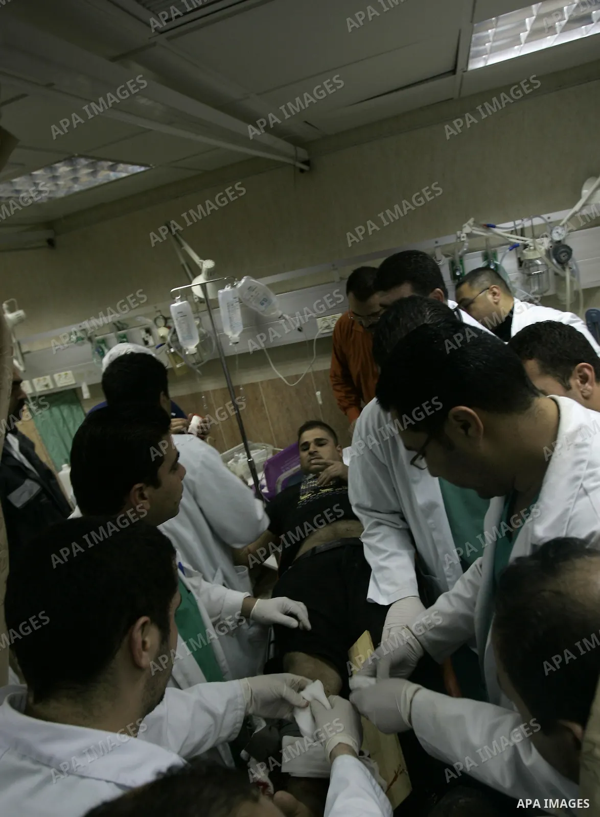 Palestinian doctors attend to a wounded youth at a hospital after being shot by a group of Jewish settlers in the village of his palace in the West Bank near Nablus March 7, 2011 , Jewish settlers and wounded 10 Palestin...