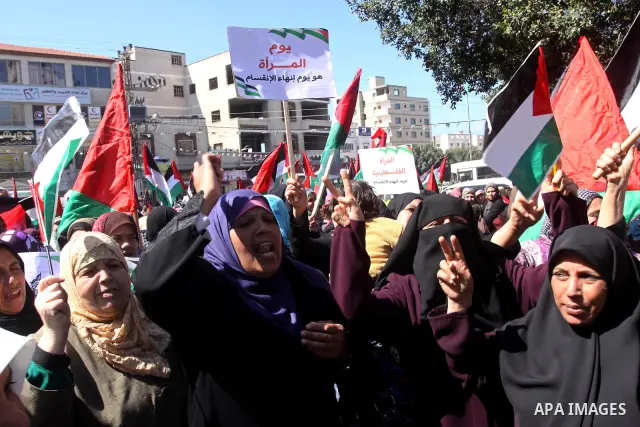 Palestinian women attend a rally calling for an end to Palestinian divisions, to mark International Women's Day in Gaza City March 8, 2011. Female protesters rallied to voice their frustrations over the unending split be...