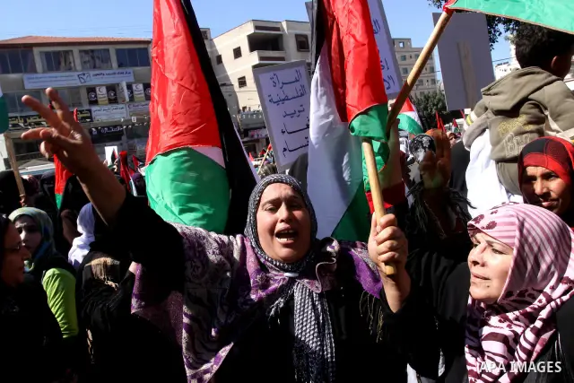 Palestinian women attend a rally calling for an end to Palestinian divisions, to mark International Women's Day in Gaza City March 8, 2011. Female protesters rallied to voice their frustrations over the unending split be...