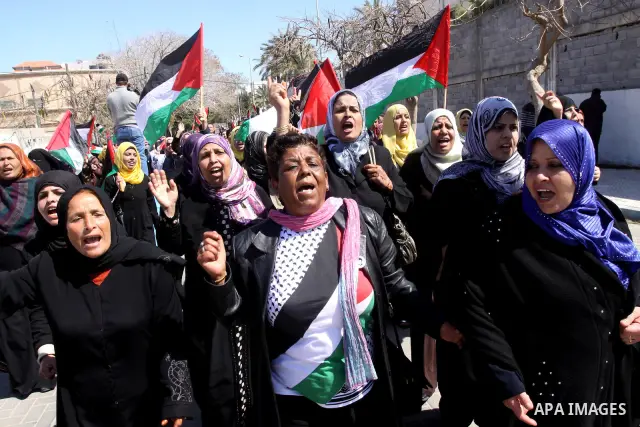 Palestinian women attend a rally calling for an end to Palestinian divisions, to mark International Women's Day in Gaza City March 8, 2011. Female protesters rallied to voice their frustrations over the unending split be...