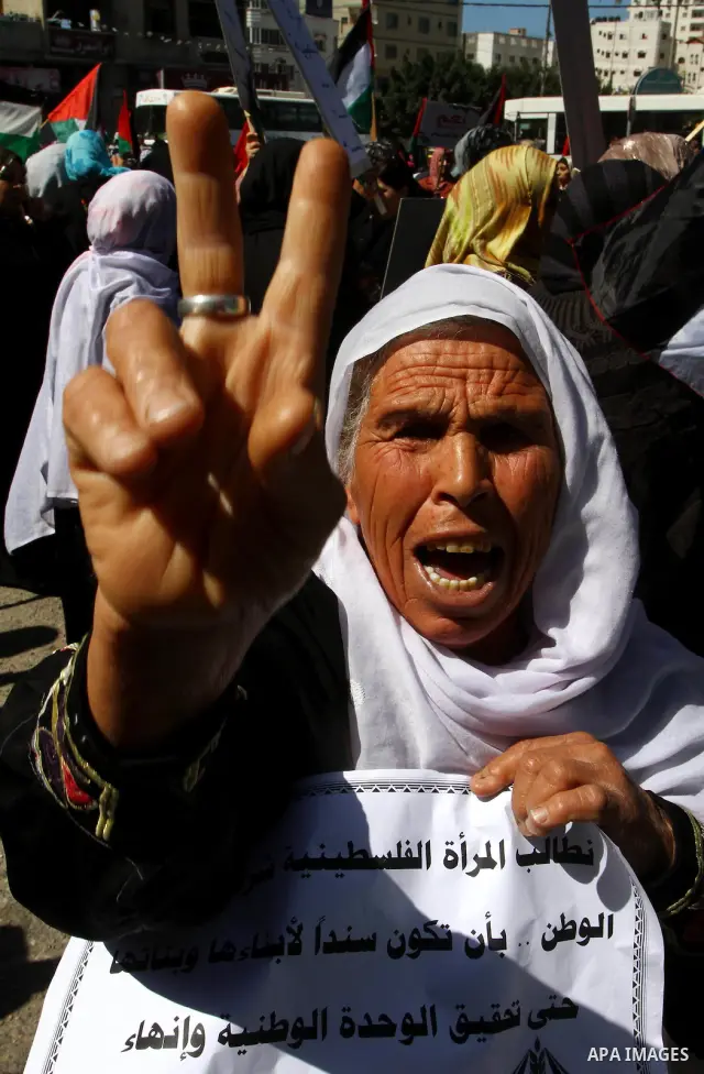 Palestinian women attend a rally calling for an end to Palestinian divisions, to mark International Women's Day in Gaza City March 8, 2011. Female protesters rallied to voice their frustrations over the unending split be...