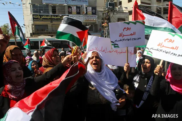 Palestinian women attend a rally calling for an end to Palestinian divisions, to mark International Women's Day in Gaza City March 8, 2011. Female protesters rallied to voice their frustrations over the unending split be...