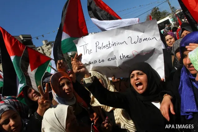 Palestinian women attend a rally calling for an end to Palestinian divisions, to mark International Women's Day in Gaza City March 8, 2011. Female protesters rallied to voice their frustrations over the unending split be...