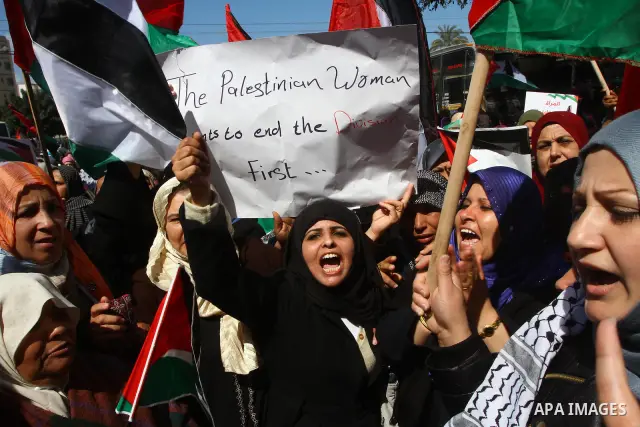 Palestinian women attend a rally calling for an end to Palestinian divisions, to mark International Women's Day in Gaza City March 8, 2011. Female protesters rallied to voice their frustrations over the unending split be...