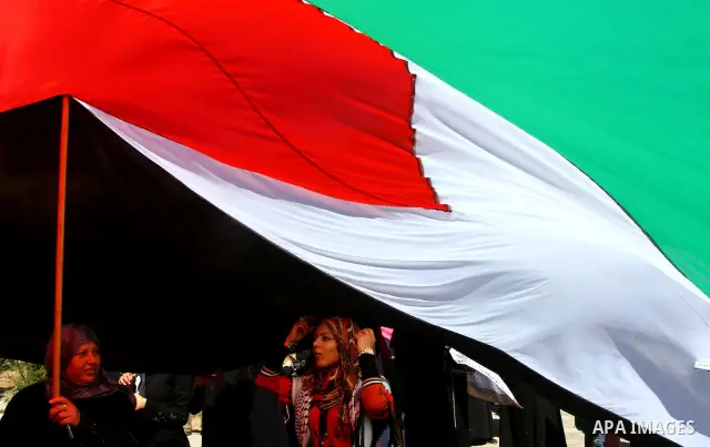 Palestinian women attend a rally calling for an end to Palestinian divisions, to mark International Women's Day in Gaza City March 8, 2011. Female protesters rallied to voice their frustrations over the unending split be...