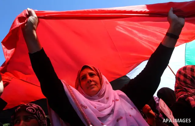 Palestinian women attend a rally calling for an end to Palestinian divisions, to mark International Women's Day in Gaza City March 8, 2011. Female protesters rallied to voice their frustrations over the unending split be...