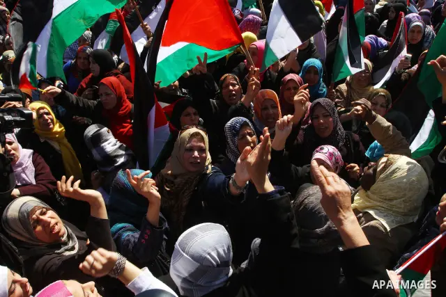 Palestinian women attend a rally calling for an end to Palestinian divisions, to mark International Women's Day in Gaza City March 8, 2011. Female protesters rallied to voice their frustrations over the unending split be...