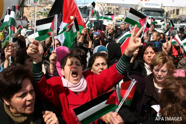 Palestinian women protest against the Israeli occupation of Palestinian territories on the occasion of women's day on March 8, 2011 at the Israeli-controlled Qalandia checkpoint, between Jerusalem and Ramallah. photo by:...