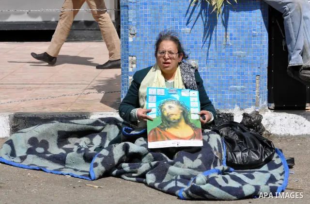 Egyptian Coptic Christians take part in a protest in front of the Information center building in Cairo, Egypt, 09 March 2011. The Coptic Christians were protesting over the burning of a church in Cairo suburbs on 04 Marc...
