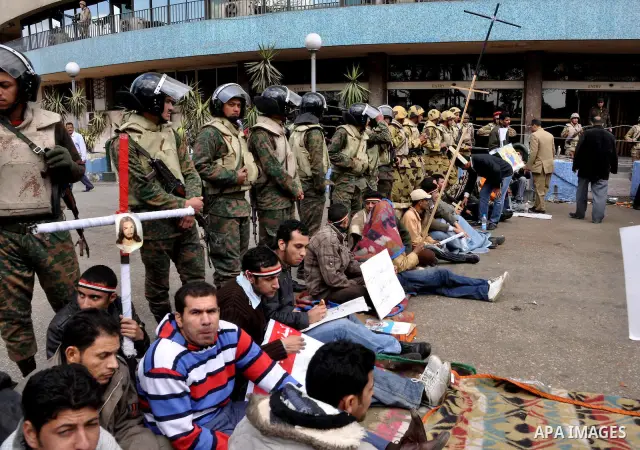 Egyptian Coptic Christians take part in a protest in front of the Information center building in Cairo, Egypt, 09 March 2011. The Coptic Christians were protesting over the burning of a church in Cairo suburbs on 04 Marc...