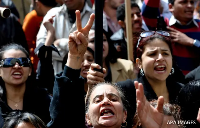 Egyptian Coptic Christians take part in a protest in front of the Information center building in Cairo, Egypt, 09 March 2011. The Coptic Christians were protesting over the burning of a church in Cairo suburbs on 04 Marc...