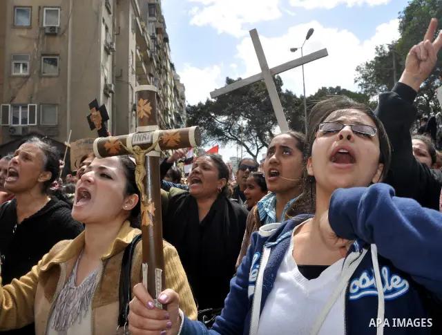 Egyptian Coptic Christians take part in a protest in front of the Information center building in Cairo, Egypt, 09 March 2011. The Coptic Christians were protesting over the burning of a church in Cairo suburbs on 04 Marc...