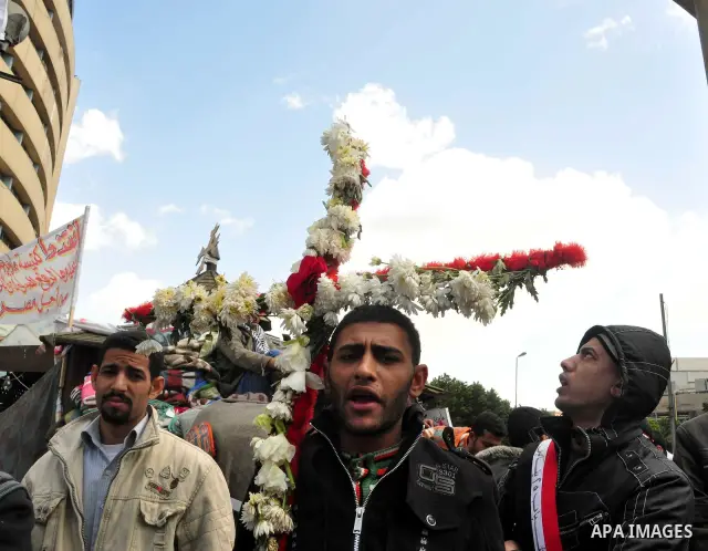 Egyptian Coptic Christians take part in a protest in front of the Information center building in Cairo, Egypt, 09 March 2011. The Coptic Christians were protesting over the burning of a church in Cairo suburbs on 04 Marc...