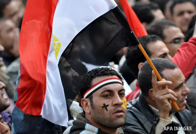 Egyptian Coptic Christians take part in a protest in front of the Information center building in Cairo, Egypt, 09 March 2011. The Coptic Christians were protesting over the burning of a church in Cairo suburbs on 04 Marc...