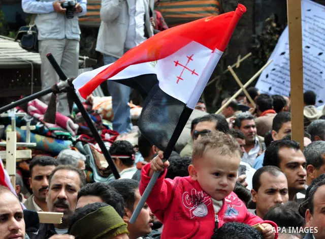 Egyptian Coptic Christians take part in a protest in front of the Information center building in Cairo, Egypt, 09 March 2011. The Coptic Christians were protesting over the burning of a church in Cairo suburbs on 04 Marc...